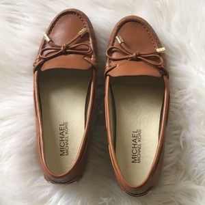 Michael Kors brown flats.
